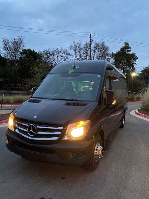 Luxury Sprinter van interior with leather seating for Austin group travel
